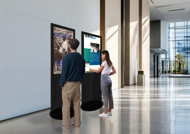 Visitors interacting with the We the People of Illinois digital traveling exhibit
